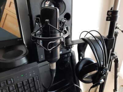 Quality microphone and earphones for online piano lessons.