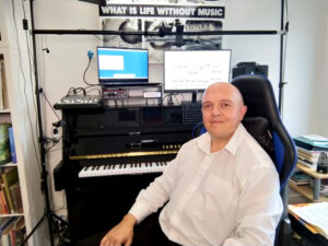 Emiliano at his Cork piano studio, offering a wholesome approach to classical and jazz piano.